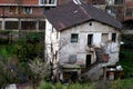 Abandoned single-family house with two floors and exterior staircase and garden