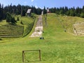 Abandoned ski jumps on Igman mountain, Sarajevo Winter Olympic Games in 1984. Royalty Free Stock Photo