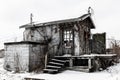 Abandoned snow covered electrical shack - Worn, Broken and Forgotten I Royalty Free Stock Photo