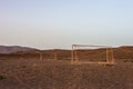 Abandoned soccer goal in the desert at sunset Royalty Free Stock Photo