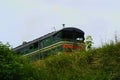 Abandoned rusted soviet locomotive at grass