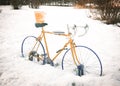 An abandoned sport cycle in the snow