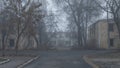 An abandoned street with abandoned two-story houses on a foggy day Royalty Free Stock Photo