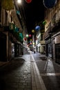 Abandoned Street With Shops In The Illuminated City Of Carcassonne In The Night In Occitania, France