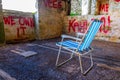 abandoned summer chair inside of an empty room decorated by various graphitti in gibraltar...IMAGE Royalty Free Stock Photo