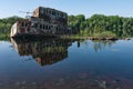 Abandoned sunken Barges Boats On River Pripyat in Chernobyl exclusion Zone. Chernobyl Nuclear Power Plant Zone of Alienation in