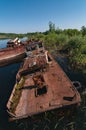 Abandoned sunken Barges Boats On River Pripyat in Chernobyl exclusion Zone. Chernobyl Nuclear Power Plant Zone of Alienation in Royalty Free Stock Photo