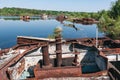 Abandoned sunken Barges Boats On River Pripyat in Chernobyl exclusion Zone. Chernobyl Nuclear Power Plant Zone of Alienation in Royalty Free Stock Photo