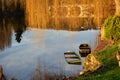 Abandoned sunken wooden boats in river in low light