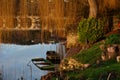 Abandoned sunken wooden boats in river in low light