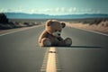 Abandoned teddy bear in the middle of nowhere on a lonely road