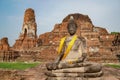 Abandoned temple in Ayutthaya Thailand with Buddha statue in front