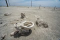 Abandoned toliet sits buried in the sand in Bombay Beach California, an abandoned town at the Salton Sea