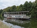 Abandoned tourist boat on a side arm of river Meuse