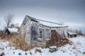 Abandoned Tourist Cabin In Field With Snow