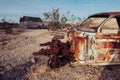 Abandoned town in the desert with rusty cars and destroyed houses Royalty Free Stock Photo