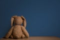 Abandoned toy bunny on table Royalty Free Stock Photo