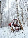 Abandoned tractor in the snow,