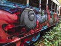 Abandoned trolley cars looking down side close up