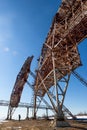 Abandoned troposphere station. Woman and huge tropospheric communication antennas. Royalty Free Stock Photo