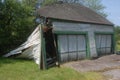 Abandoned Two Car Garage collapse bursting