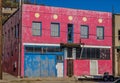 Abandoned Two Story Building With Boarded Up Doors Royalty Free Stock Photo