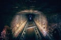 Abandoned underground sewer brick tunnel, dark dirty industrial corridor, tube perspective view