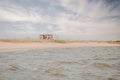 Abandoned uninhabited old hut on the empty Azov sea bank