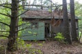 An abandoned very old house in the middle of woods . Royalty Free Stock Photo