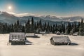 Abandoned village, wooden cabins in winter Carpathian mountains under moonlight Royalty Free Stock Photo