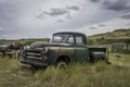 Abandoned vintage green pick up truck on Saskatchewan prairies