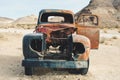 Abandoned vintage rusty pickup truck car wreck in the desert, Rhyolite, Death Valley National Park, California, USA.car wreck in Royalty Free Stock Photo
