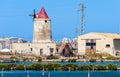 Abandoned windmill in a plant for the production of sea salt Royalty Free Stock Photo