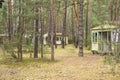 Abandoned wooden mobile homes in a forgotten, abandoned holiday resort on an autumn day. Mess