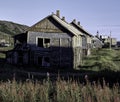 Abandoned wooden old rural house. Deserted country village, desolation and ruin Royalty Free Stock Photo