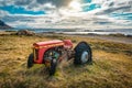 Abandoned wreck of old tractor on the sea shore in Iceland