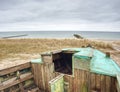 Abandoned wrecked boat stuck in sand. Old wooden boat on the sandy shore Royalty Free Stock Photo