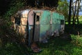 Abandoned Wrecked retro caravan. Nature takes over Royalty Free Stock Photo