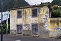 Abandoned yellow building in front of an asphalted road Seixal, madeira Royalty Free Stock Photo