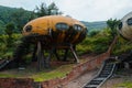 Abandoned Yellow Rusty UFO House Near A Forest In Wanli UFO Village, Taiwan