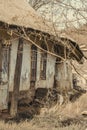 Abanoned old traditional house in ukranian village. Slanted walls, rural devastation
