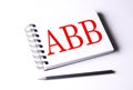 ABB word on notebook on white background