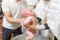 Abbe blessing a little infant kid in baptism christening cerem