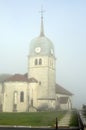 Abbey church in Jura, France and cure house of the priest. Royalty Free Stock Photo