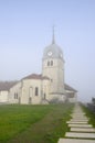 Abbey church in Jura, France and cure (house of the priest). Royalty Free Stock Photo