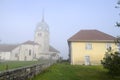 Abbey church in Jura, France and cure (house of the priest). Royalty Free Stock Photo