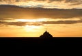 abbey of Mont saint-michel in Normandy in northern France at sunset with fiery sky Royalty Free Stock Photo