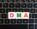 Abbreviation DMA on keyboard background Royalty Free Stock Photo