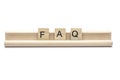 Abbreviation of FAQ on scrabble wooden letters on a rack