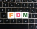 Abbreviation FDM on keyboard background